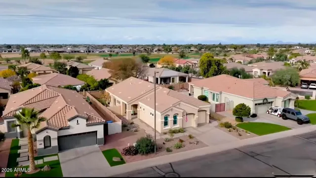 a living room with a fireplace and a flat screen tv