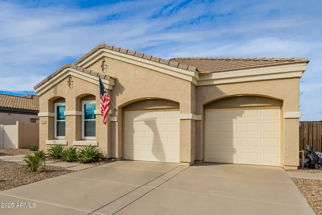 a view of a dining room with furniture and a chandelier