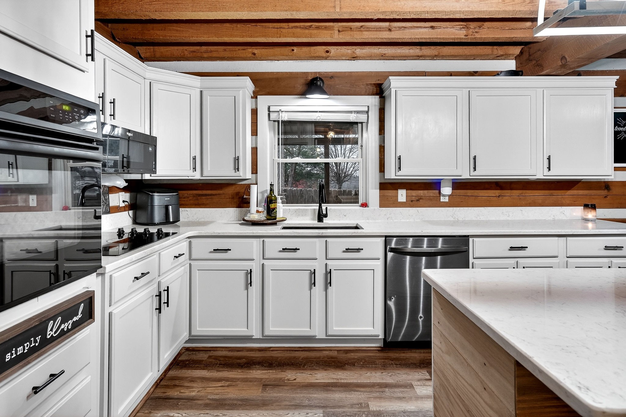 1399 Bethany Road McMinnville, TN 37110 - Photo 11 of 36 a kitchen with stainless steel appliances granite countertop a stove a sink and a microwave