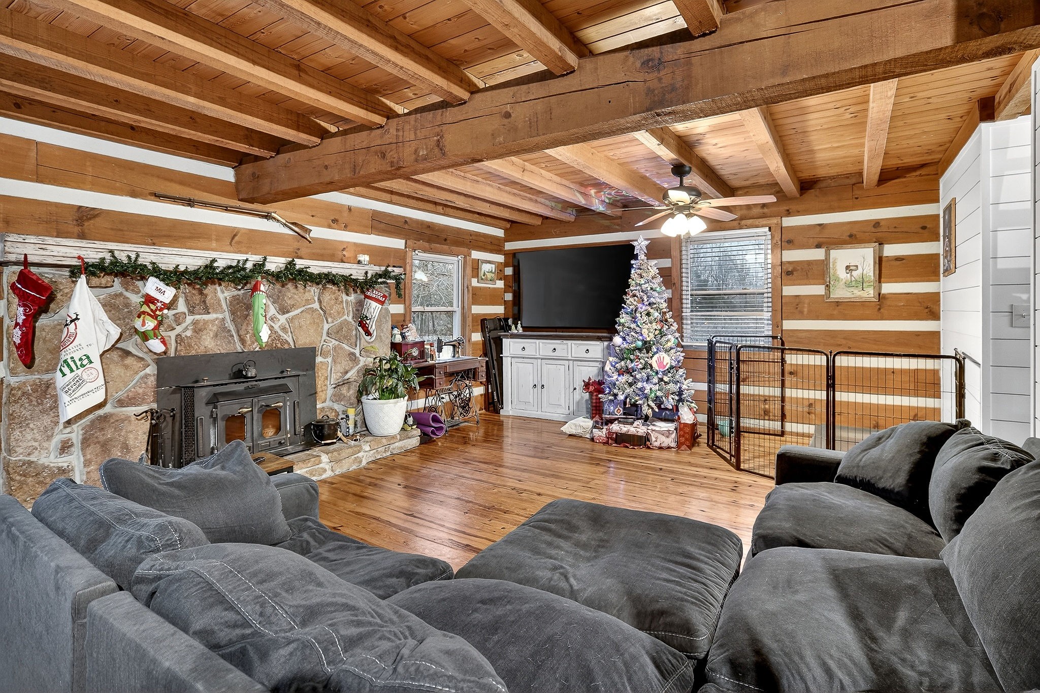 1399 Bethany Road McMinnville, TN 37110 - Photo 2 of 36 a living room with furniture a fireplace and a flat screen tv