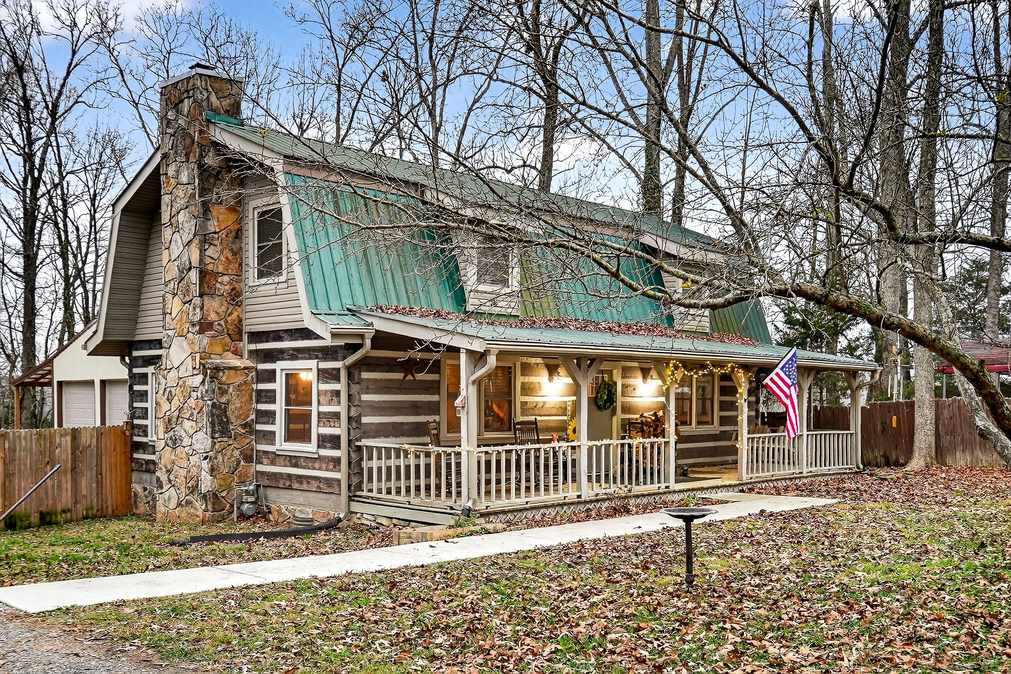 1399 Bethany Road McMinnville, TN 37110 - Photo 25 of 36 a porch with a bench next to a yard