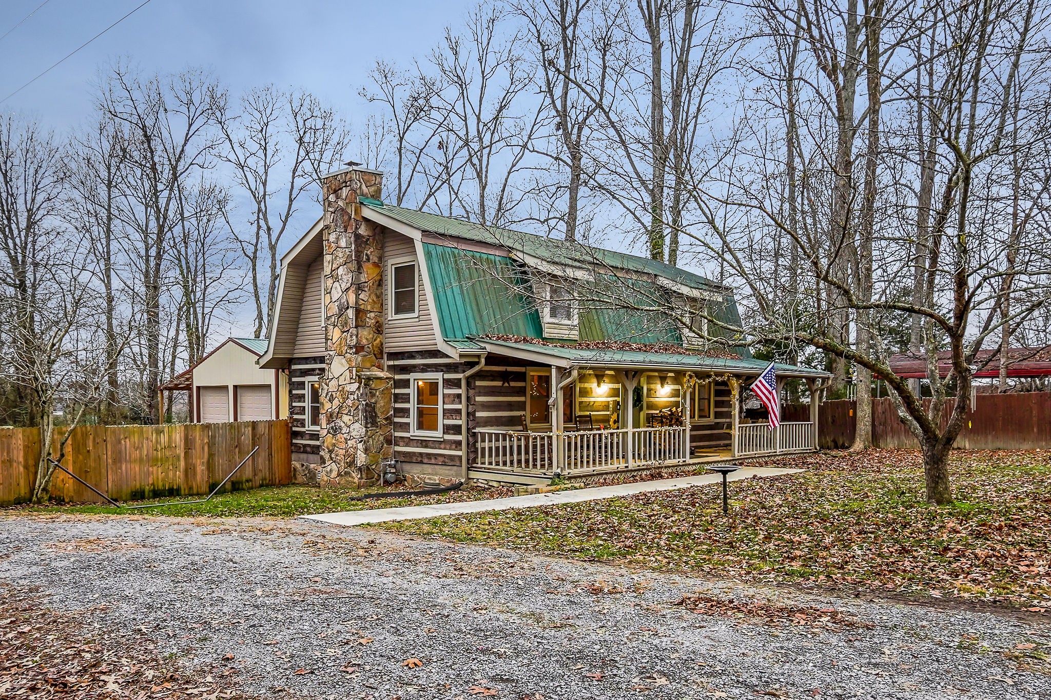 1399 Bethany Road McMinnville, TN 37110 - Photo 32 of 36 a front view of a house with a yard and garage