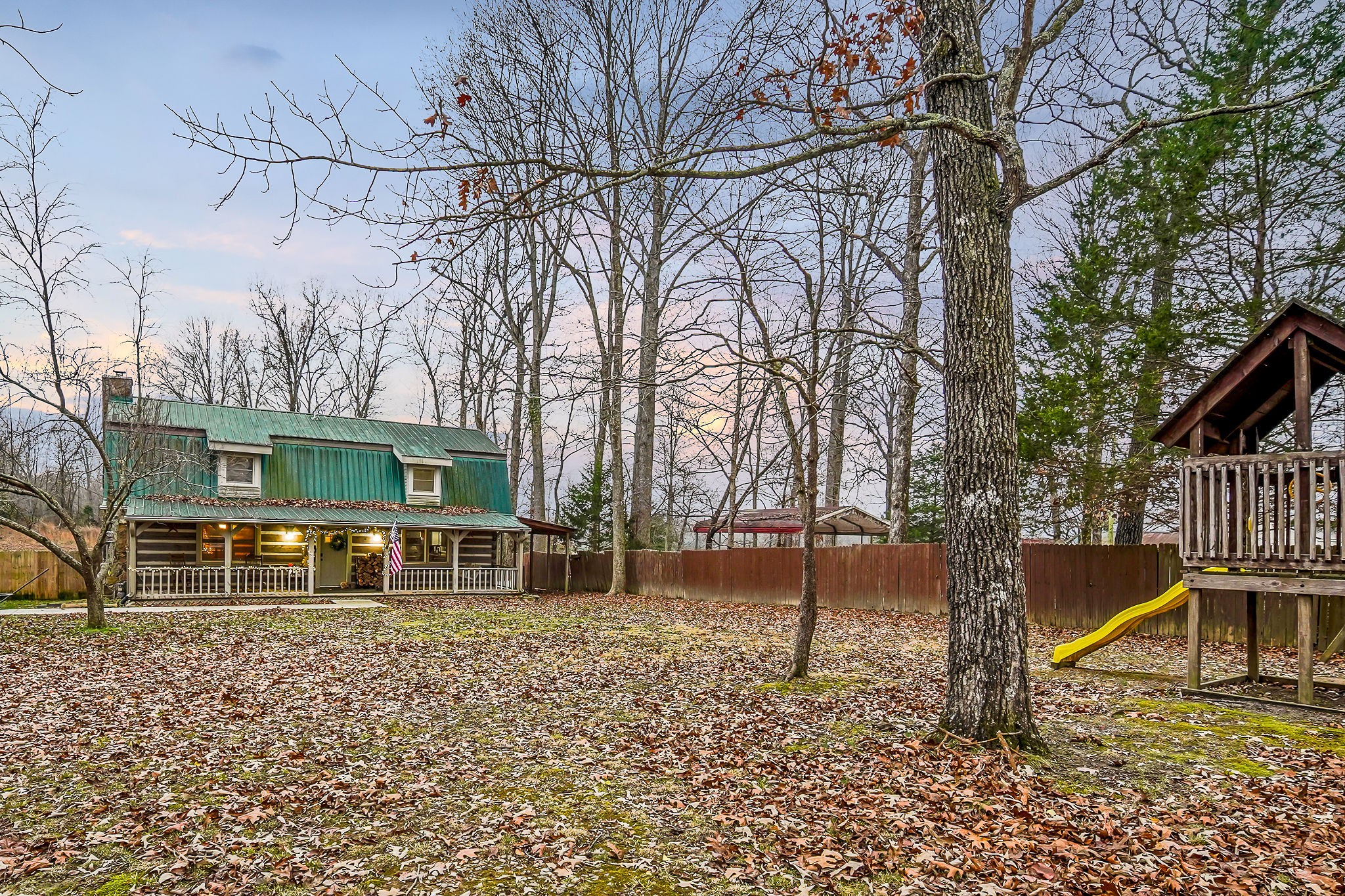 1399 Bethany Road McMinnville, TN 37110 - Photo 34 of 36 a backyard of a house with table and chairs