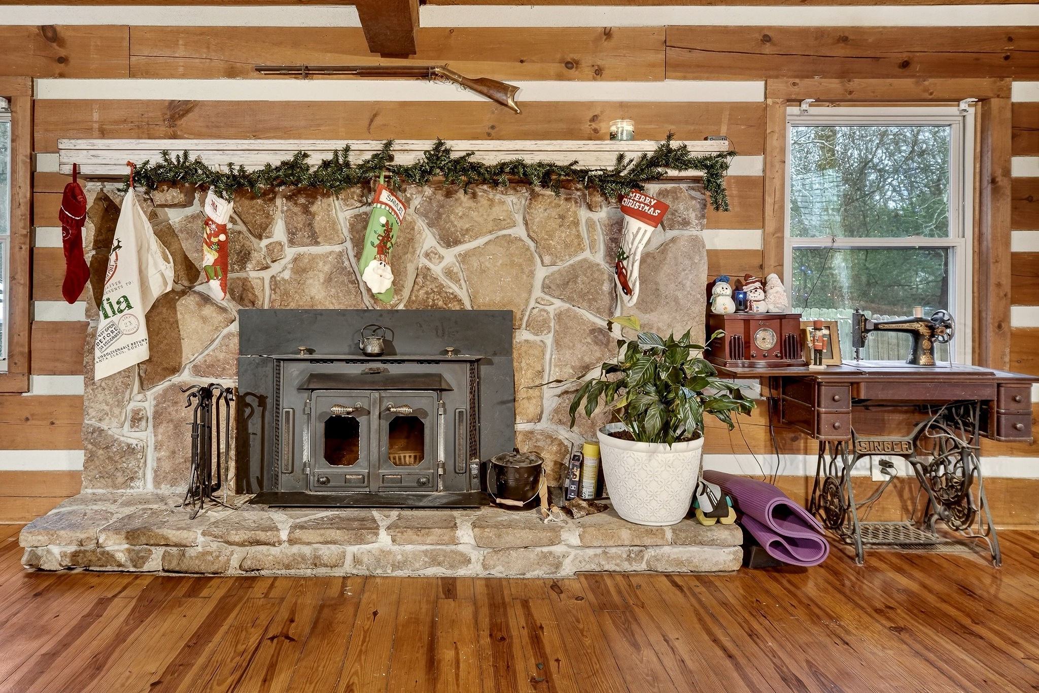 1399 Bethany Road McMinnville, TN 37110 - Photo 4 of 36 a living room with a fireplace and a table