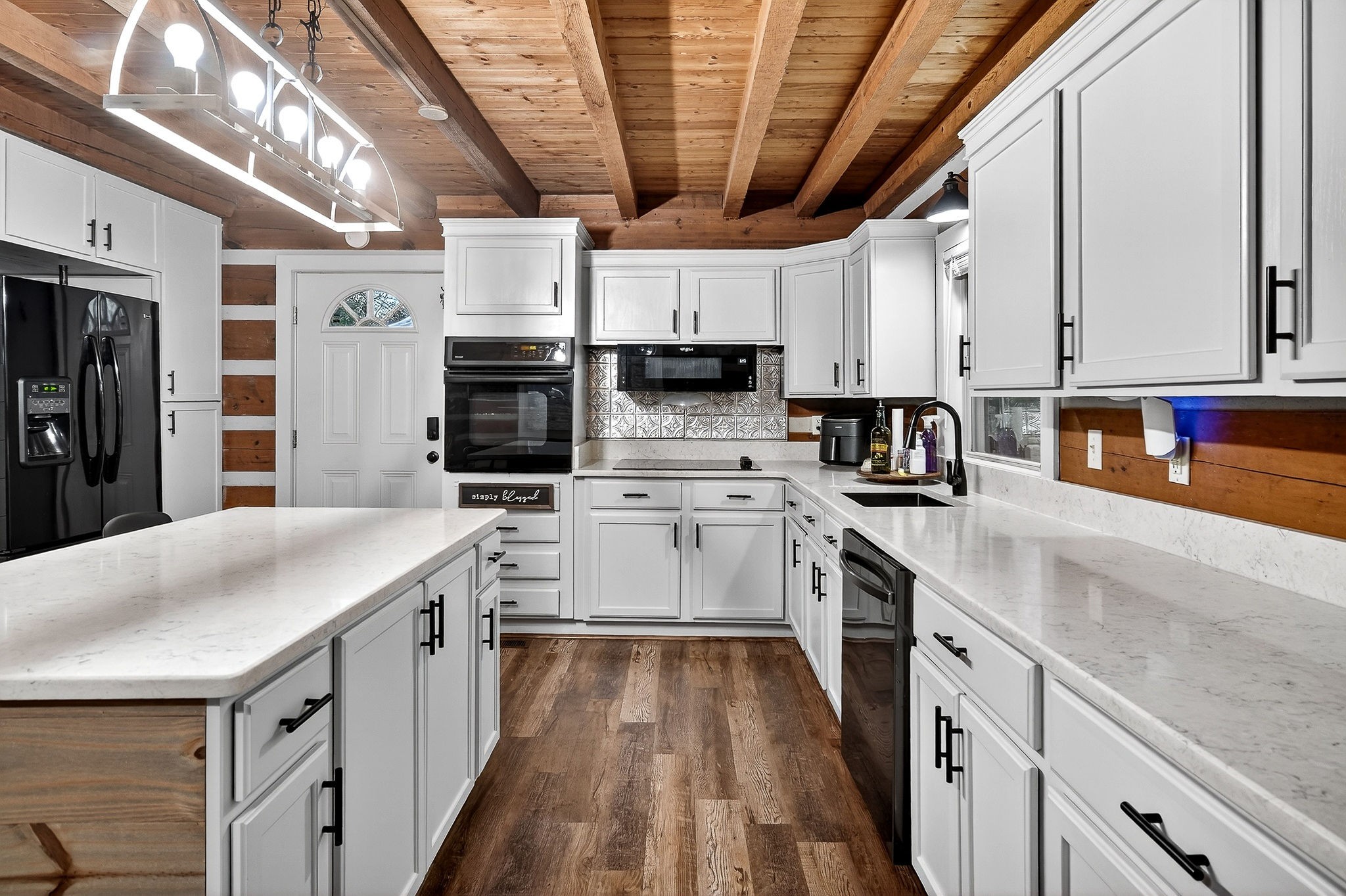 1399 Bethany Road McMinnville, TN 37110 - Photo 9 of 36 a kitchen with stainless steel appliances granite countertop a sink a stove and a refrigerator