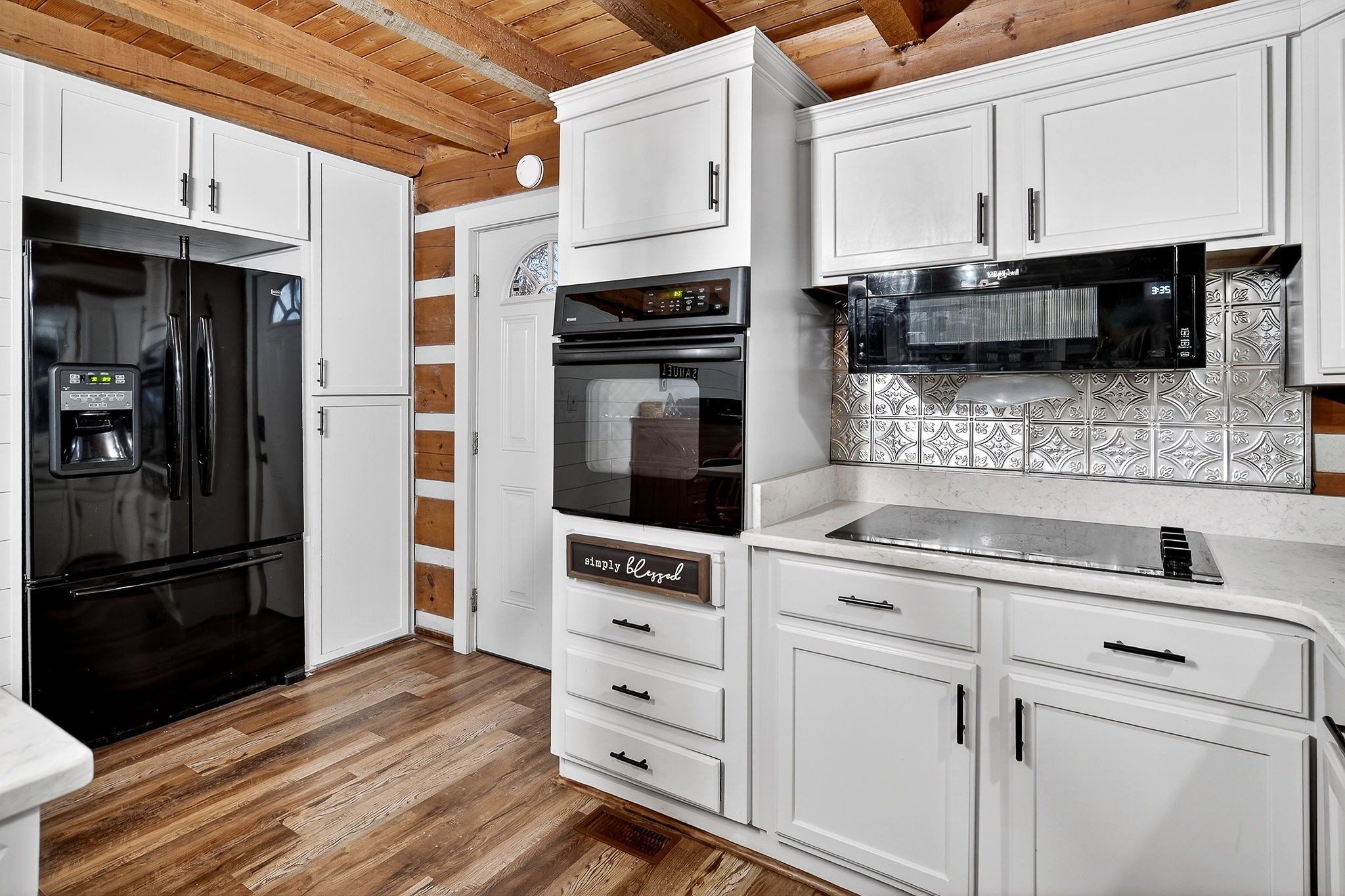 1399 Bethany Road McMinnville, TN 37110 - Photo 10 of 36 a kitchen with stainless steel appliances white cabinets and a refrigerator