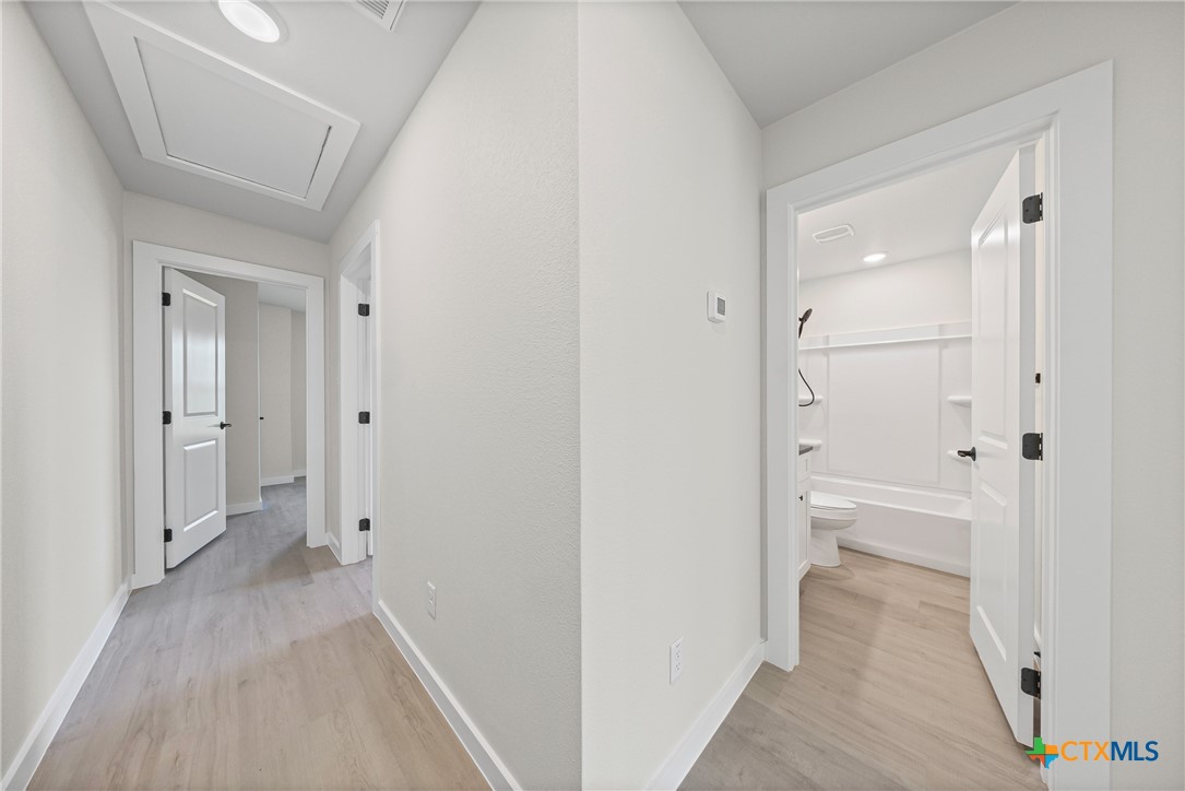 1407 South 5th Street Temple, TX 76504 - Photo 22 of 33 a view of a bathroom with a sink and a toilet