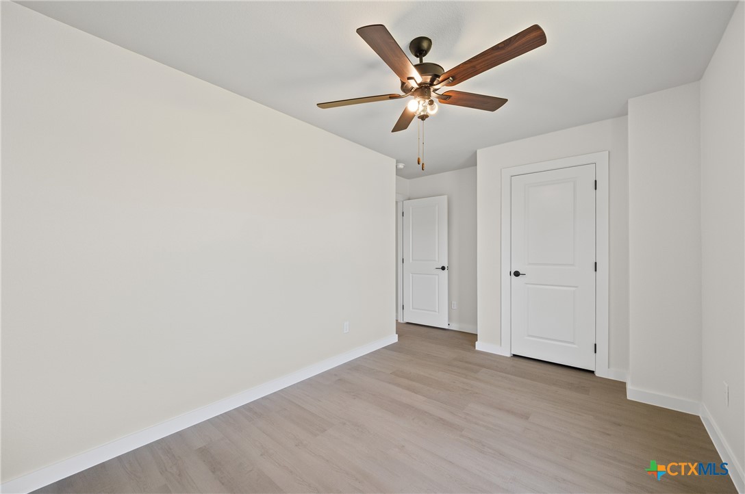 1407 South 5th Street Temple, TX 76504 - Photo 26 of 33 a view of a hallway with a ceiling fan