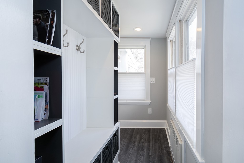 38 First Parish Road Scituate, MA 02066 - Photo 11 of 26 a view of hallway with stairs and wooden floor