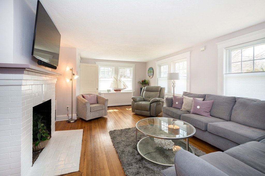 38 First Parish Road Scituate, MA 02066 - Photo 4 of 26 a living room with furniture a fireplace and a flat screen tv