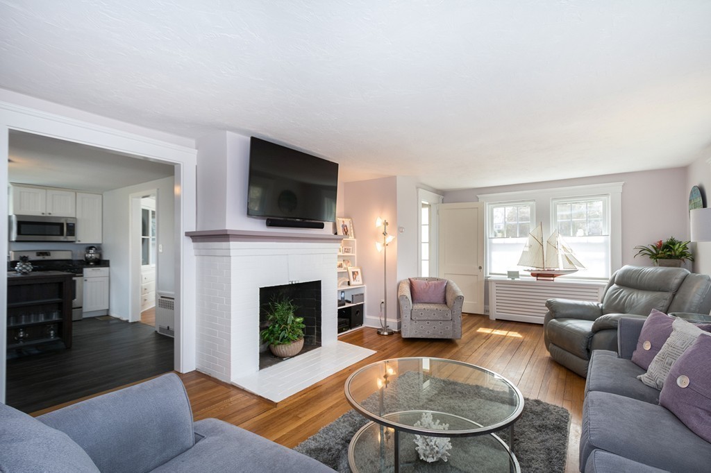38 First Parish Road Scituate, MA 02066 - Photo 5 of 26 a living room with furniture a fireplace and a flat screen tv