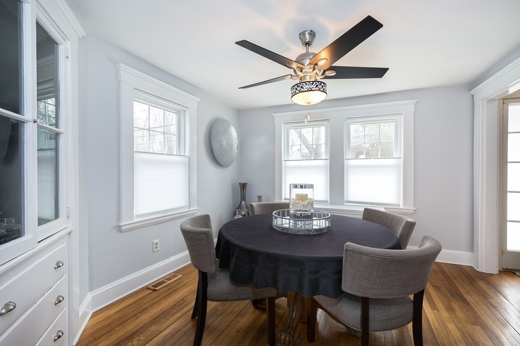 38 First Parish Road Scituate, MA 02066 - Photo 9 of 26 a dining room with furniture a window and a chandelier