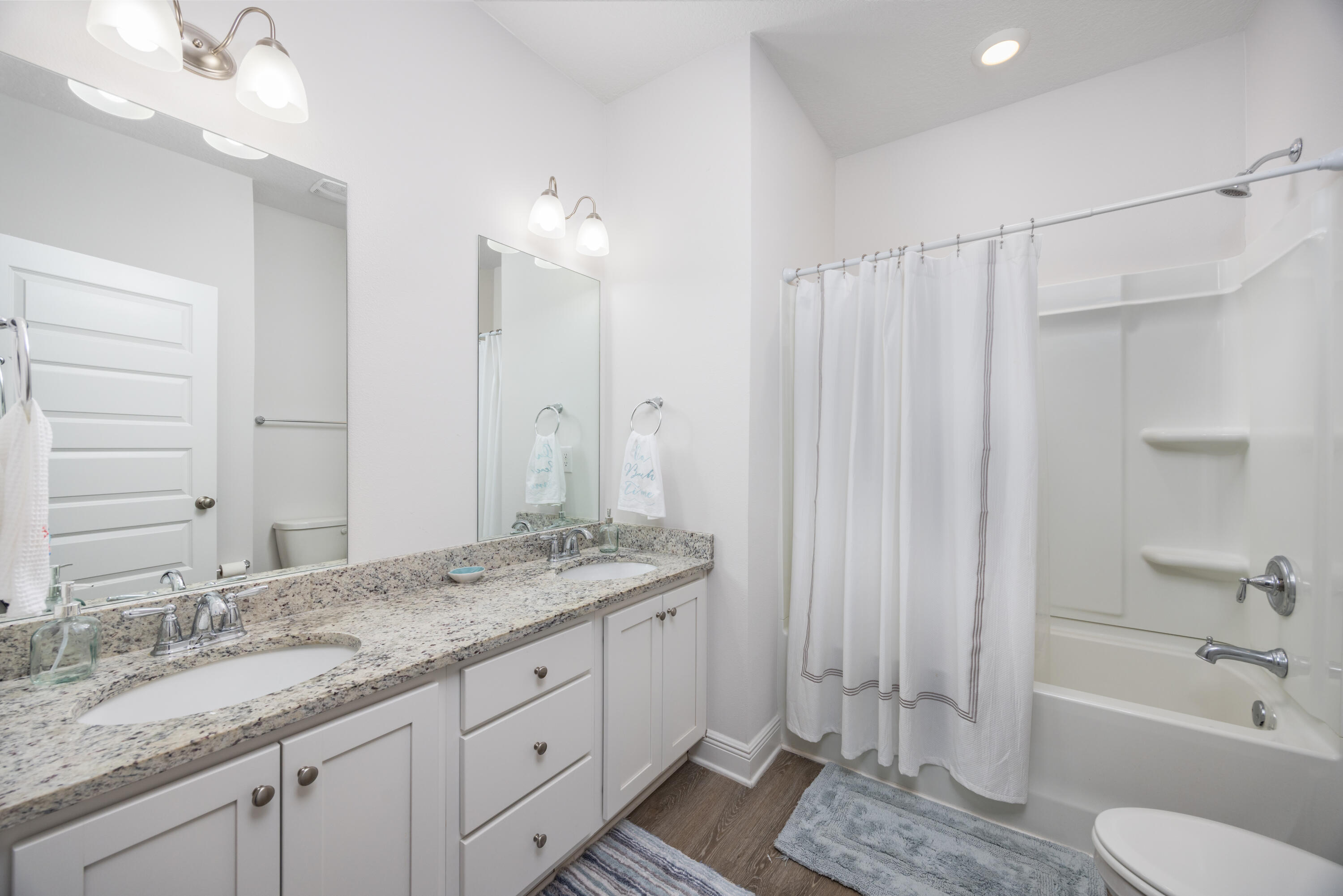 193 Perimeter Place Freeport, FL 32439 - Photo 19 of 43 a bathroom with a granite countertop sink toilet and shower