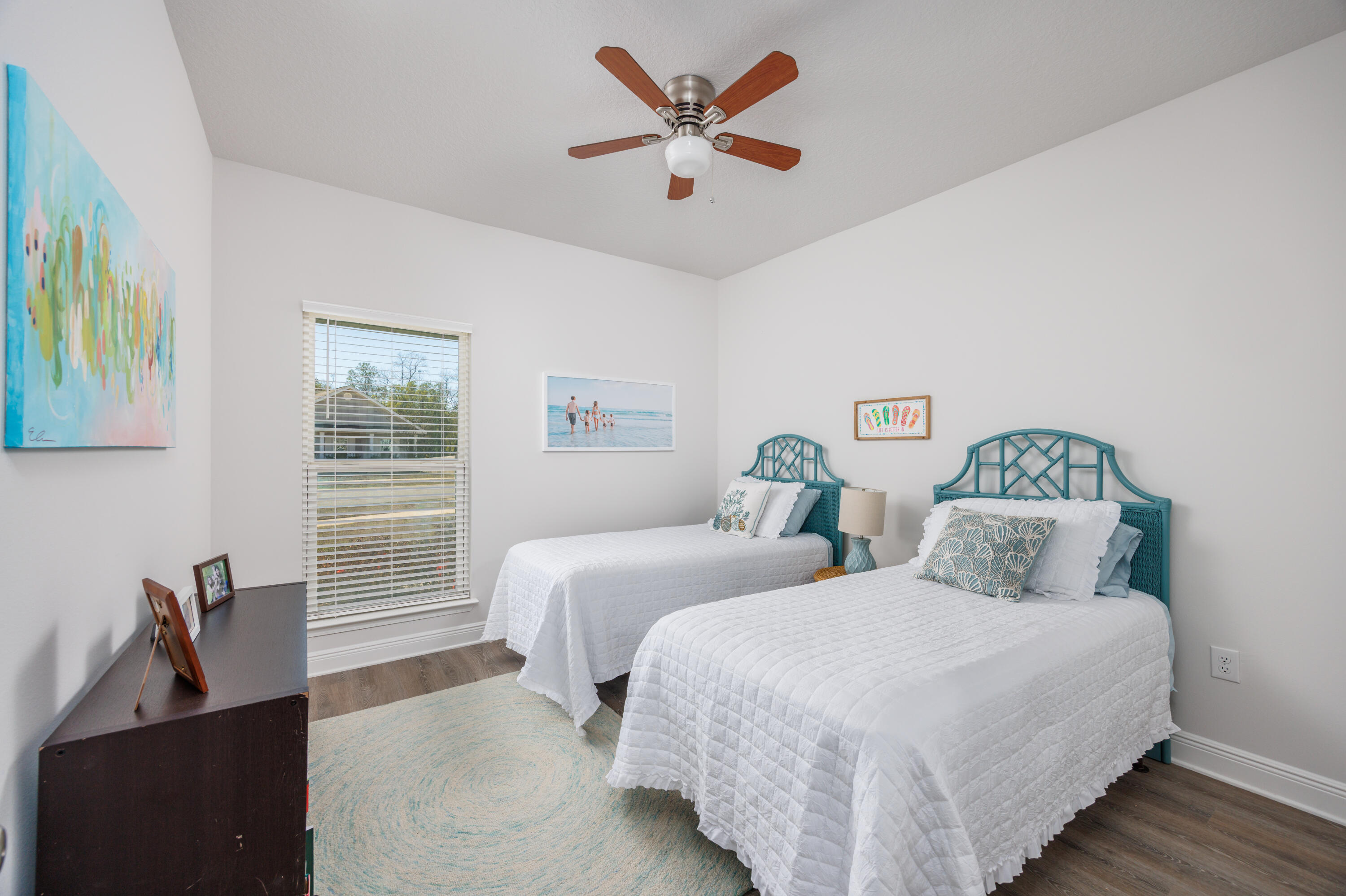 193 Perimeter Place Freeport, FL 32439 - Photo 22 of 43 a bedroom with two beds and a chandelier