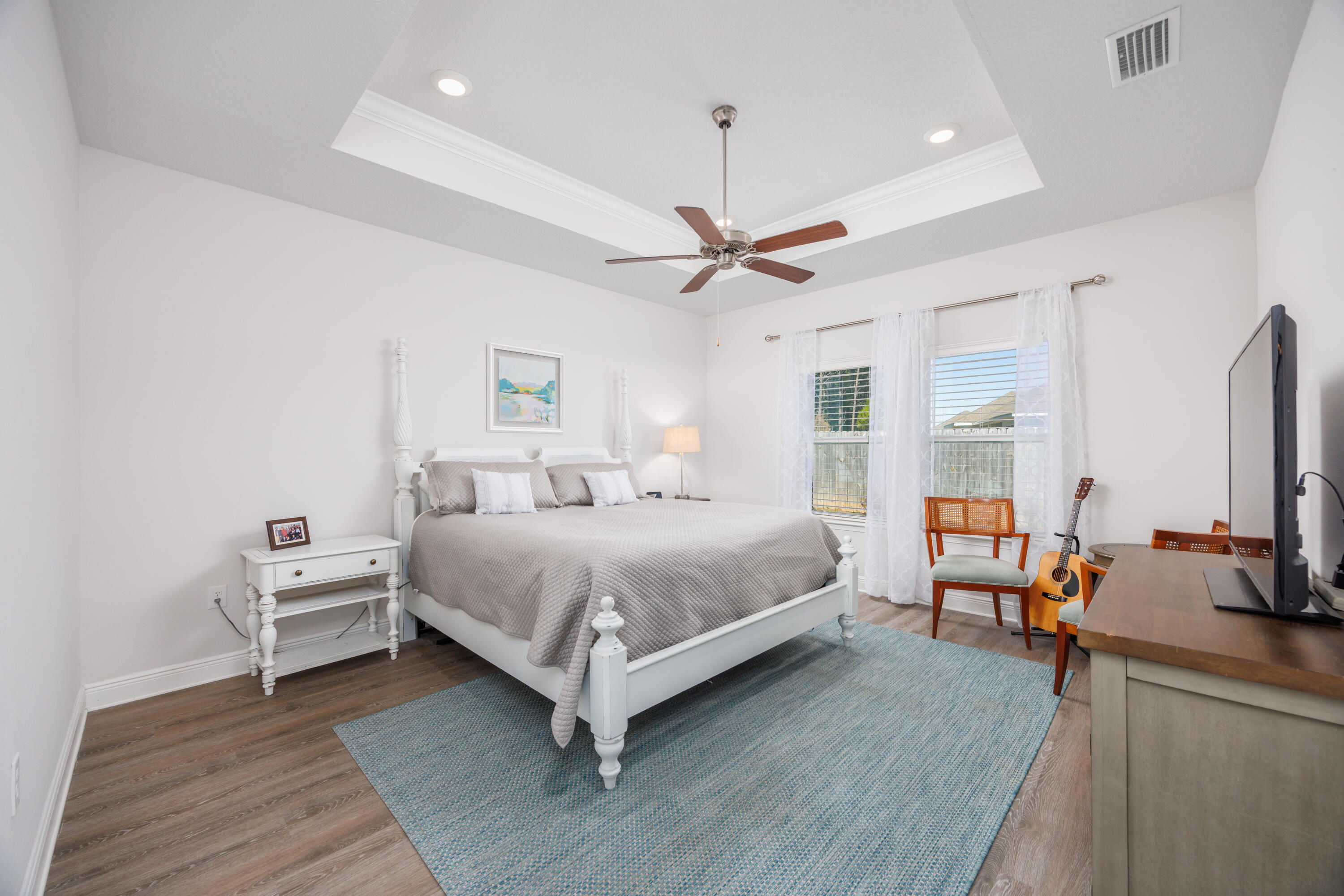 193 Perimeter Place Freeport, FL 32439 - Photo 25 of 43 a bedroom with a large bed a flat tv screen and a dresser