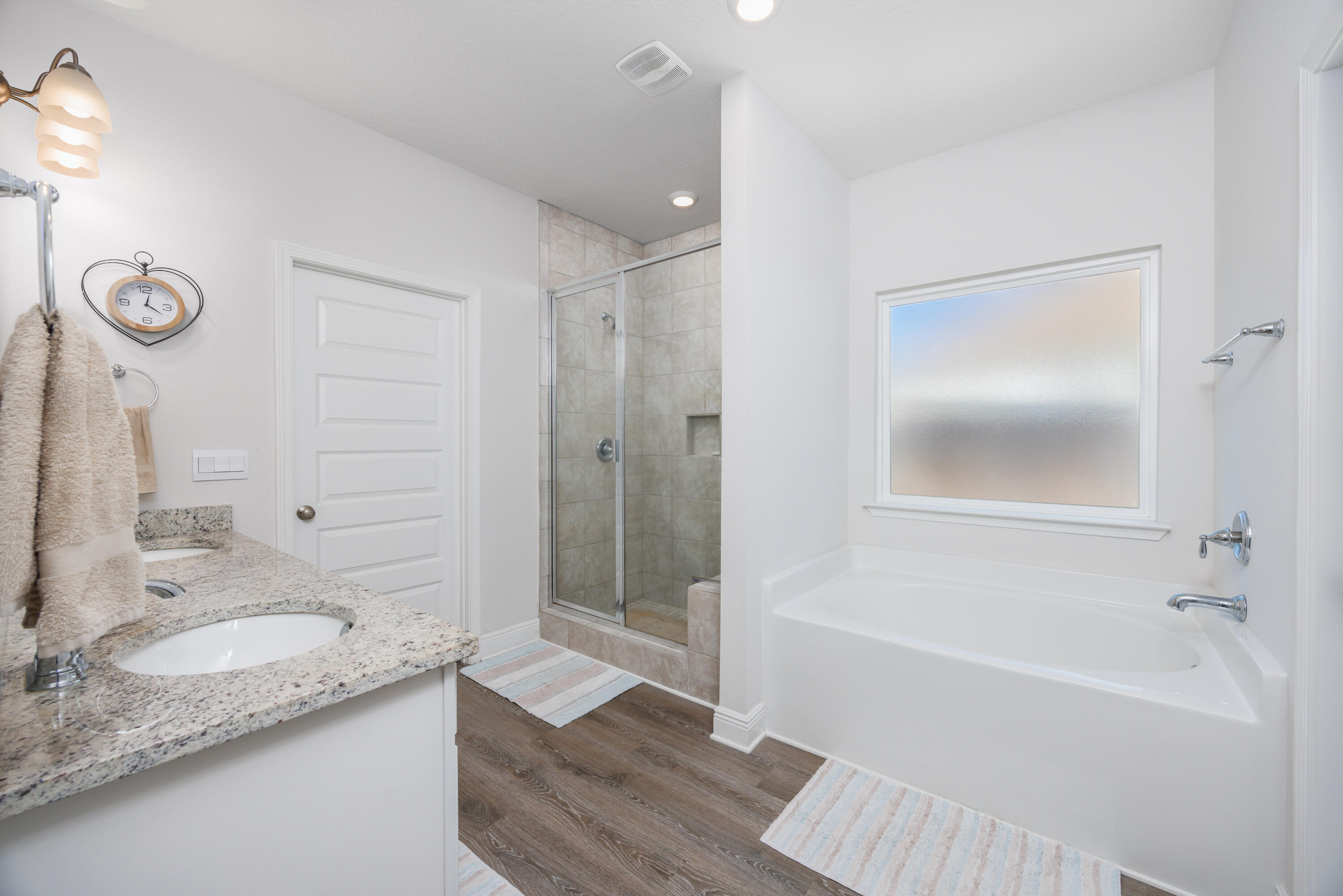 193 Perimeter Place Freeport, FL 32439 - Photo 27 of 43 a bathroom with a granite countertop bathtub shower sink vanity and mirror