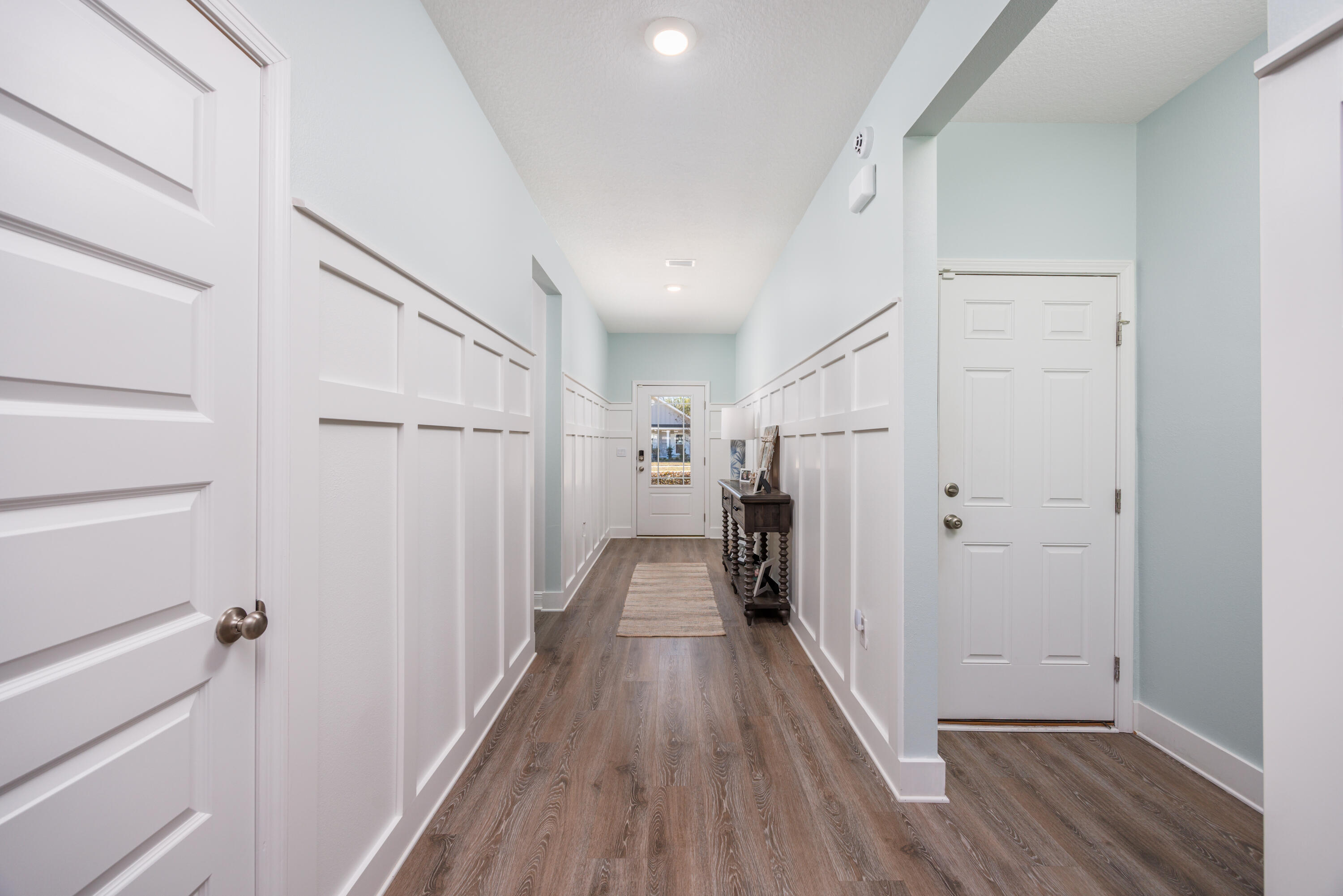 193 Perimeter Place Freeport, FL 32439 - Photo 5 of 43 a view of a hallway with wooden floor and staircase