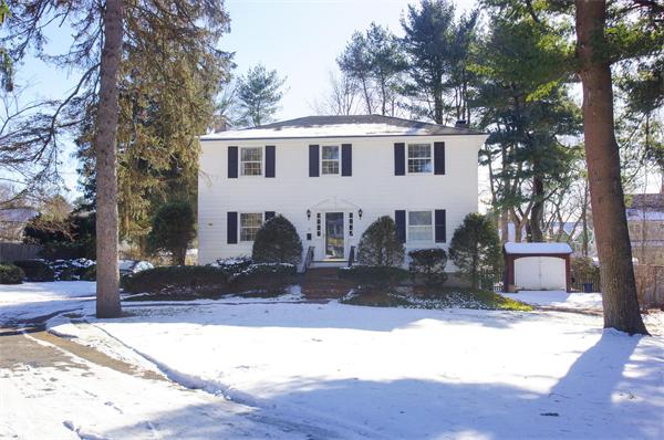 21 Elmwood Road Wellesley, MA 02481 - Photo 1 of 27 a view of a house with a yard covered with snow and a tree