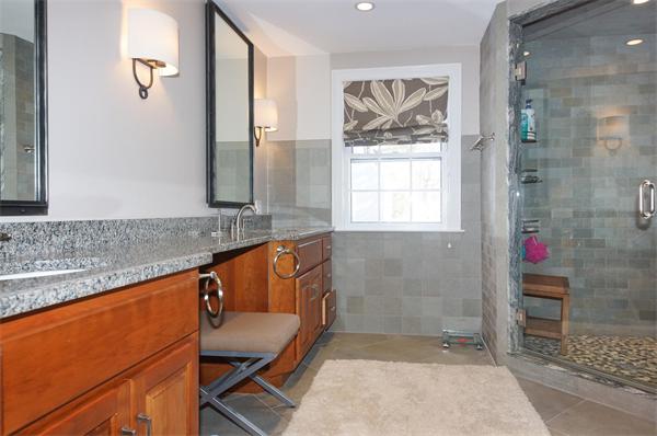 21 Elmwood Road Wellesley, MA 02481 - Photo 17 of 27 a bathroom with a granite countertop sink a mirror and a shower