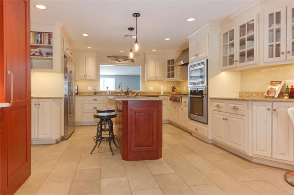 21 Elmwood Road Wellesley, MA 02481 - Photo 2 of 27 a kitchen with stainless steel appliances granite countertop a refrigerator and a stove top oven
