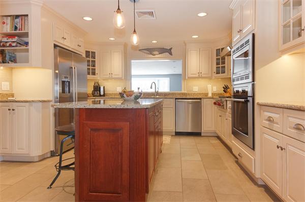 21 Elmwood Road Wellesley, MA 02481 - Photo 4 of 27 a kitchen with stainless steel appliances granite countertop a sink a stove a refrigerator and cabinets