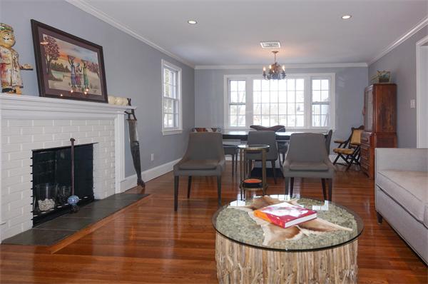 21 Elmwood Road Wellesley, MA 02481 - Photo 6 of 27 a living room with granite countertop furniture dining table and a fireplace