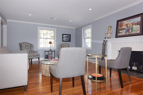 21 Elmwood Road Wellesley, MA 02481 - Photo 7 of 27 a living room with furniture a wooden floor and a table