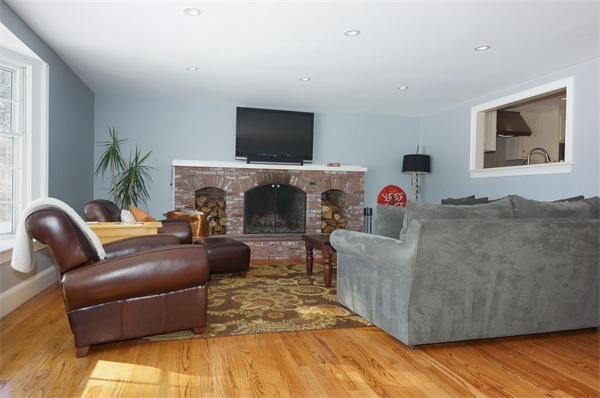 21 Elmwood Road Wellesley, MA 02481 - Photo 9 of 27 a living room with furniture and a flat screen tv