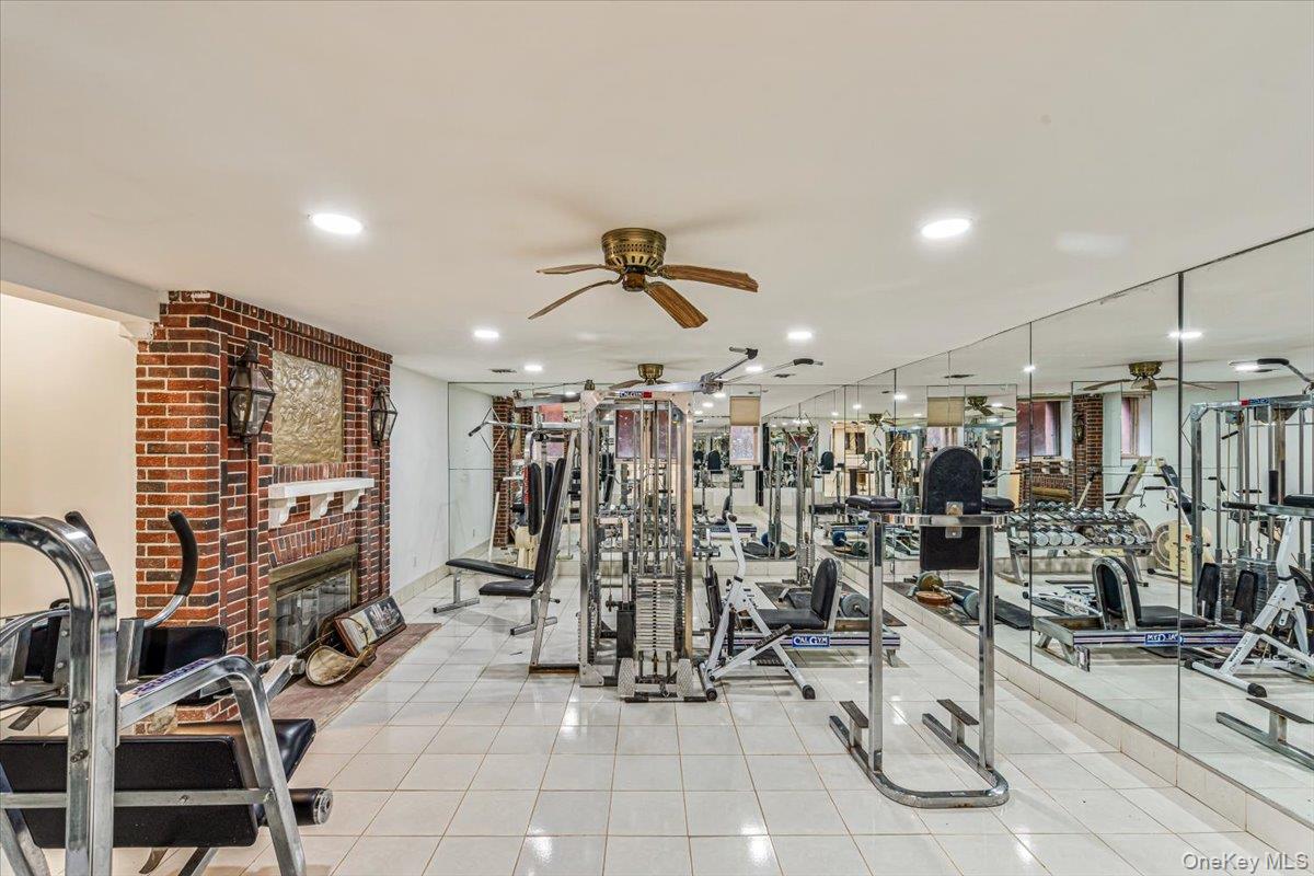 952 Cedar Swamp Road Glen Head, NY 11545 - Photo 41 of 50 a view of a room with gym equipment