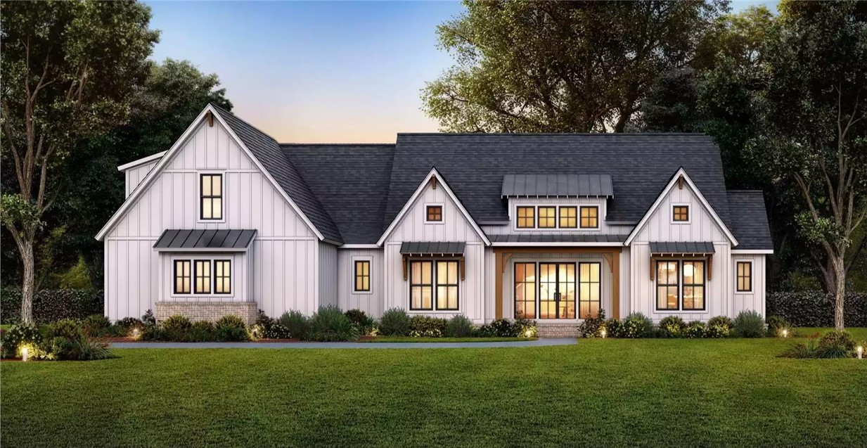 This captivating residence presents a contemporary farmhouse aesthetic with expansive landscaping.