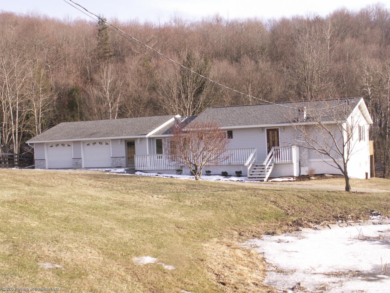 0 Rr 1 Meshoppen, PA 18630 - Photo 1 of 25 a front view of a house with a yard and garage