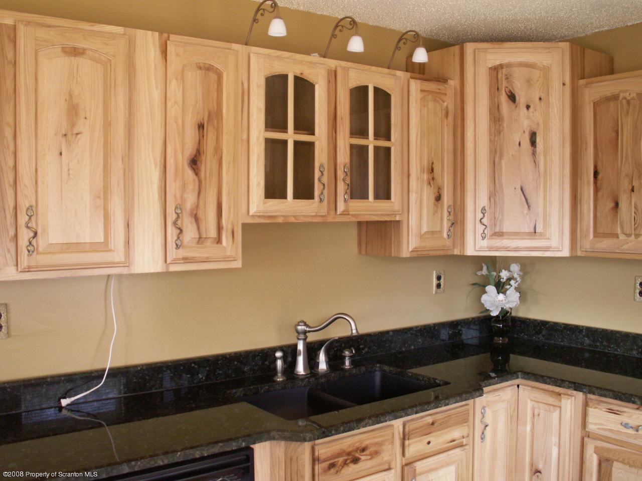0 Rr 1 Meshoppen, PA 18630 - Photo 15 of 25 a kitchen with granite countertop white cabinets and black appliances