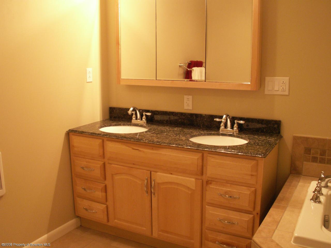 0 Rr 1 Meshoppen, PA 18630 - Photo 21 of 25 a bathroom with a sink and a mirror