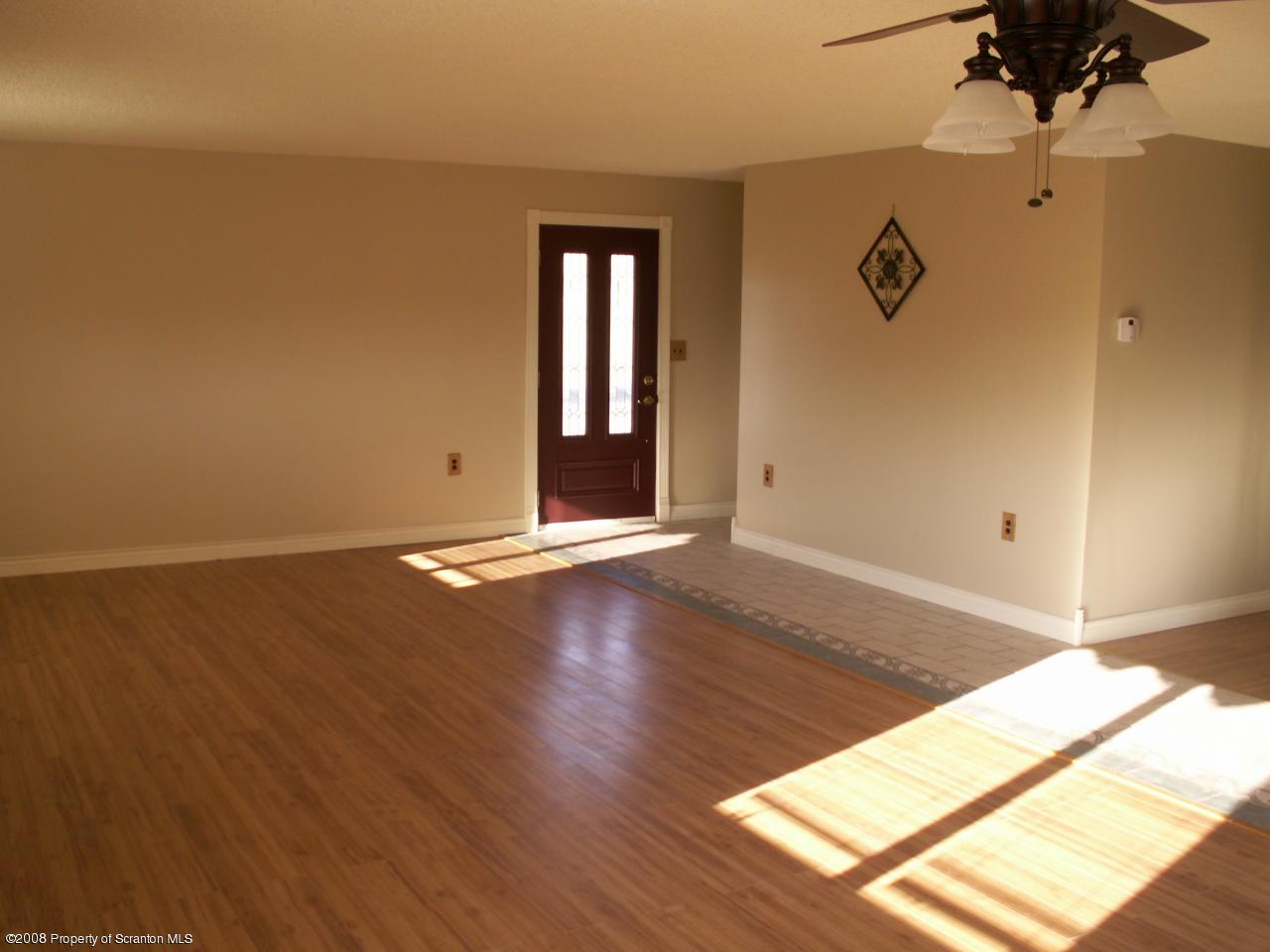 0 Rr 1 Meshoppen, PA 18630 - Photo 10 of 25 a view of an empty room with wooden floor and a window