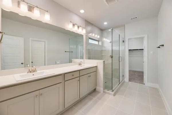 a bathroom with a double vanity sink mirror and double