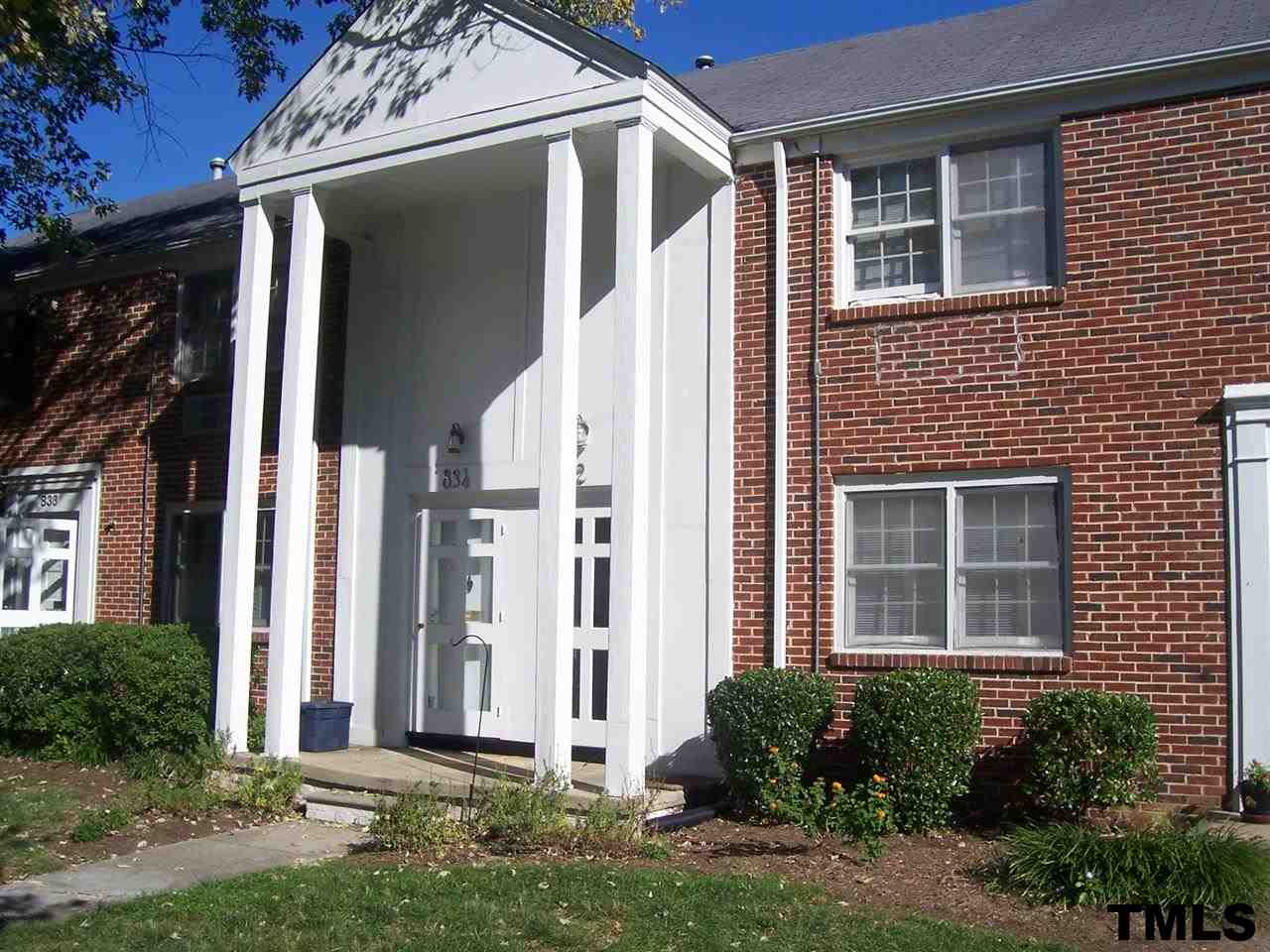 832 Bryan Street, Unit 2 Raleigh, NC 27605 - Photo 1 of 6 a front view of a house with a yard