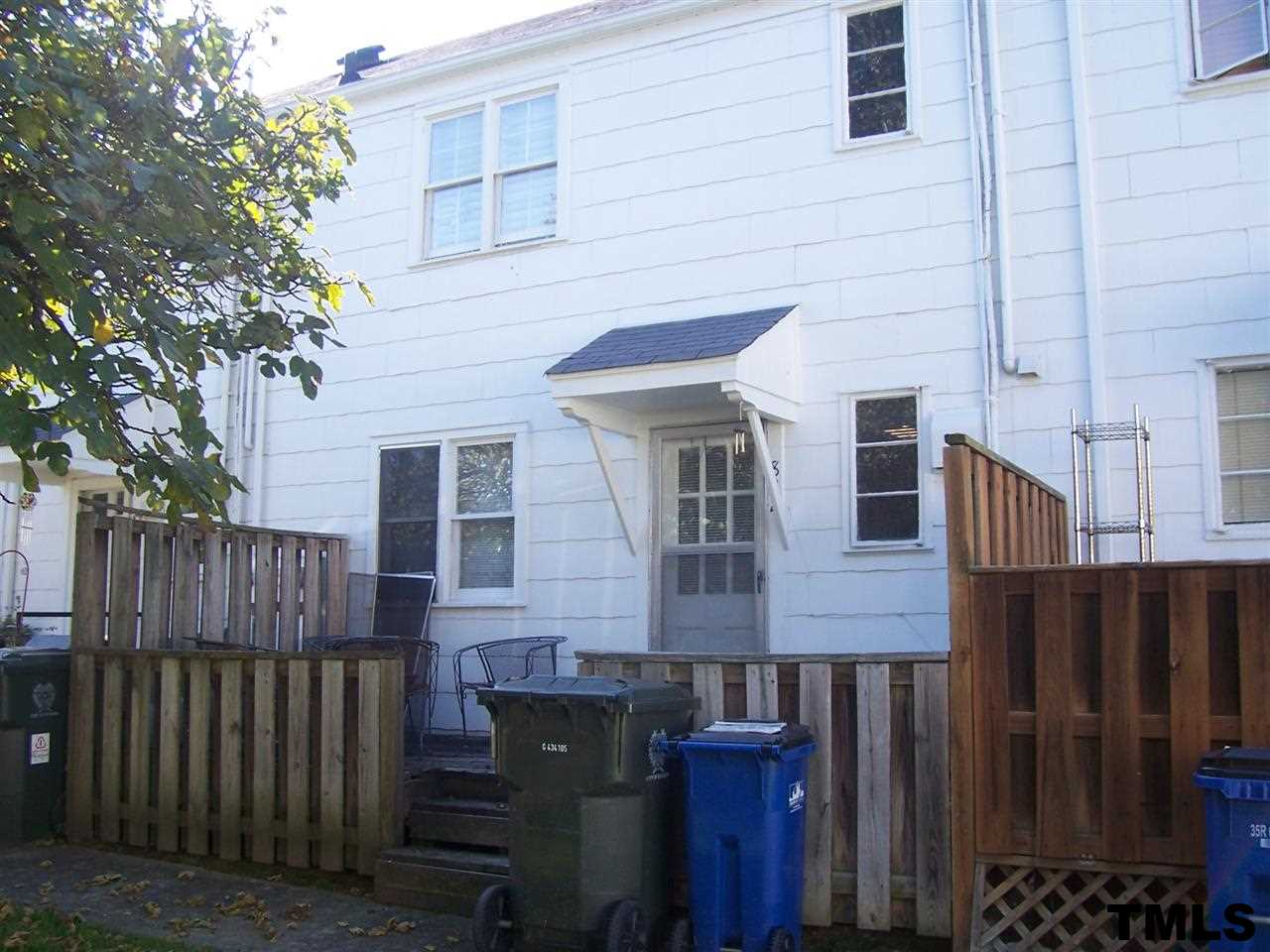 832 Bryan Street, Unit 2 Raleigh, NC 27605 - Photo 3 of 6 a view of a house with wooden fence and two windows