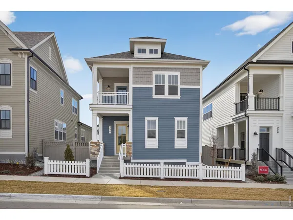 a front view of a house with a floor to ceiling window