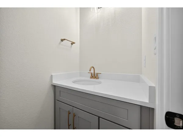 a bathroom with a sink and mirror