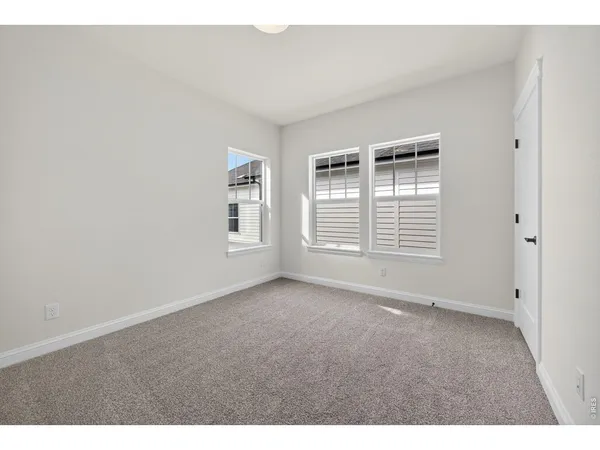 a bathroom with a double vanity sink a mirror and shower