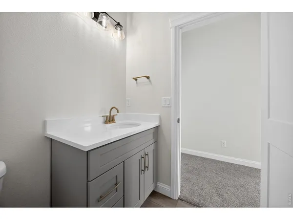 a white building with a clock on the wall