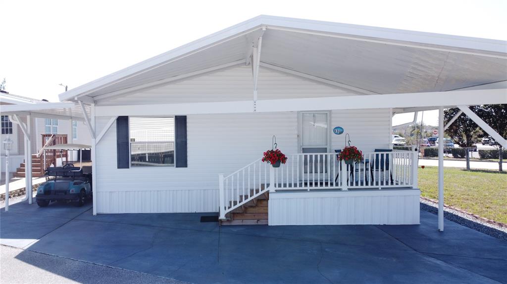 251 Patterson Road, Unit I3 Haines City, FL 33844 - Photo 1 of 38 a view of livingroom with furniture and stairs