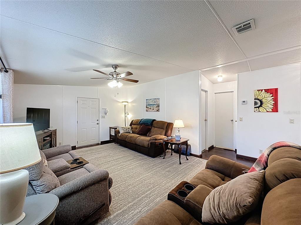 251 Patterson Road, Unit I3 Haines City, FL 33844 - Photo 14 of 38 a living room with furniture and a couch