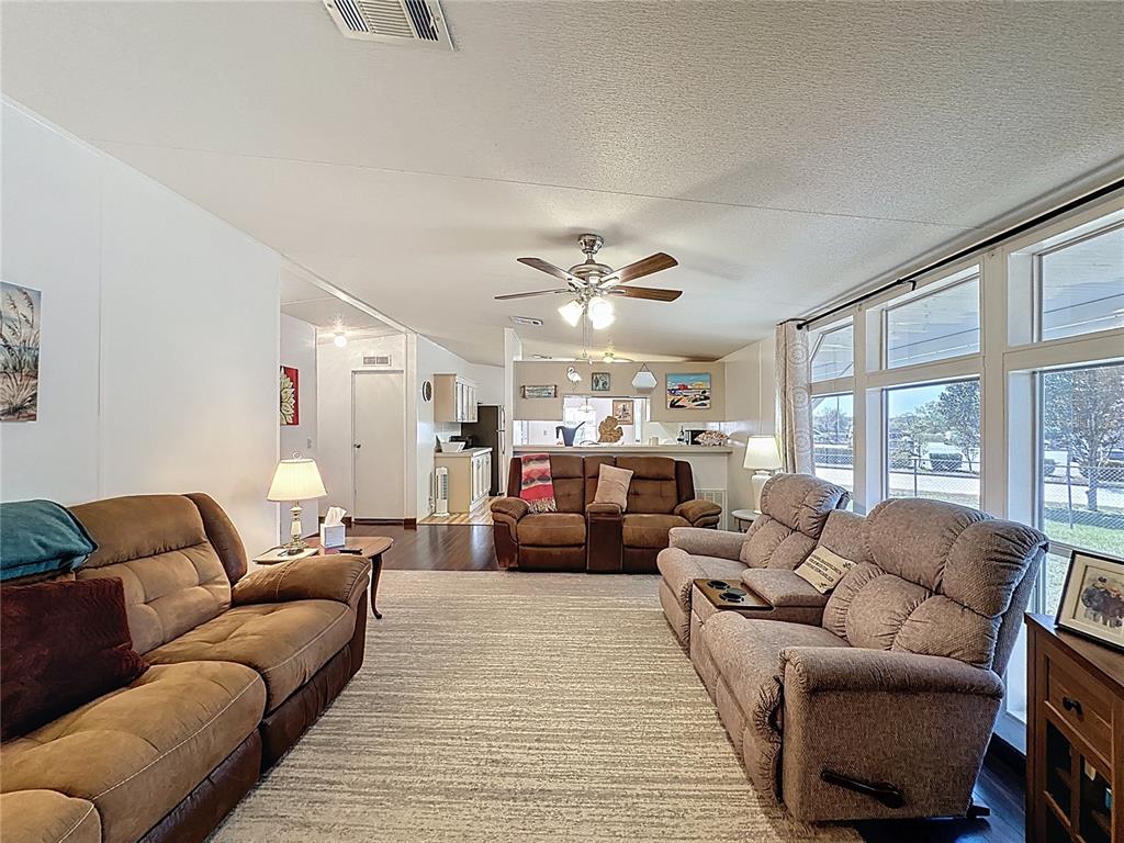 251 Patterson Road, Unit I3 Haines City, FL 33844 - Photo 15 of 38 a living room with furniture and a large window