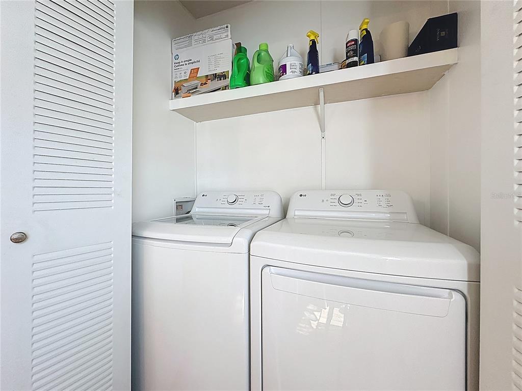 251 Patterson Road, Unit I3 Haines City, FL 33844 - Photo 27 of 38 a utility room with dryer and washer