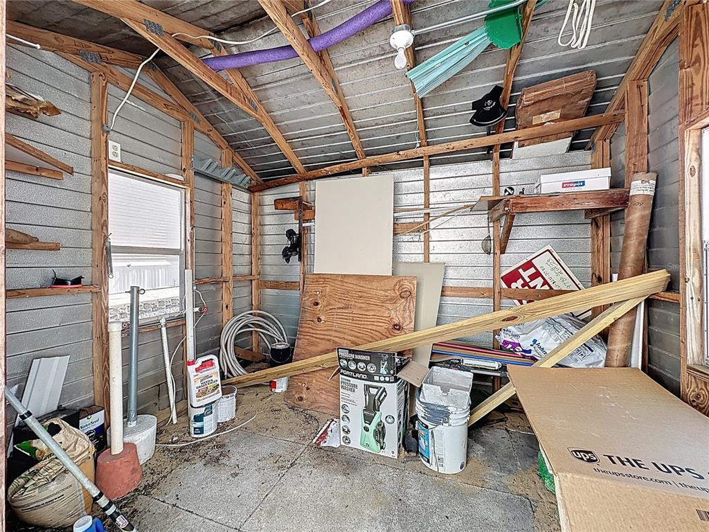 251 Patterson Road, Unit I3 Haines City, FL 33844 - Photo 28 of 38 a view of storage and utility room