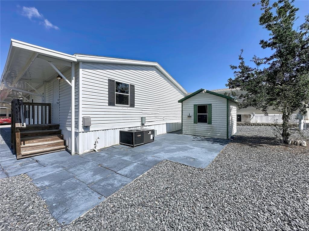 251 Patterson Road, Unit I3 Haines City, FL 33844 - Photo 29 of 38 a view of a house with a bed and a couch