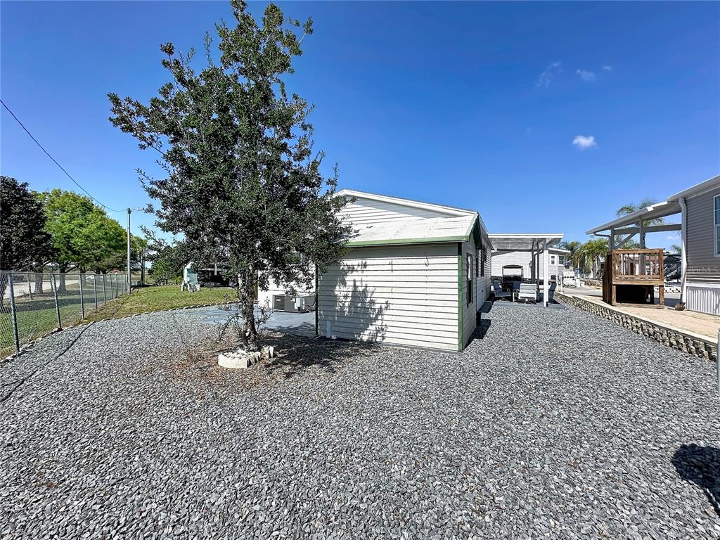 251 Patterson Road, Unit I3 Haines City, FL 33844 - Photo 30 of 38 a view of a backyard with a garden