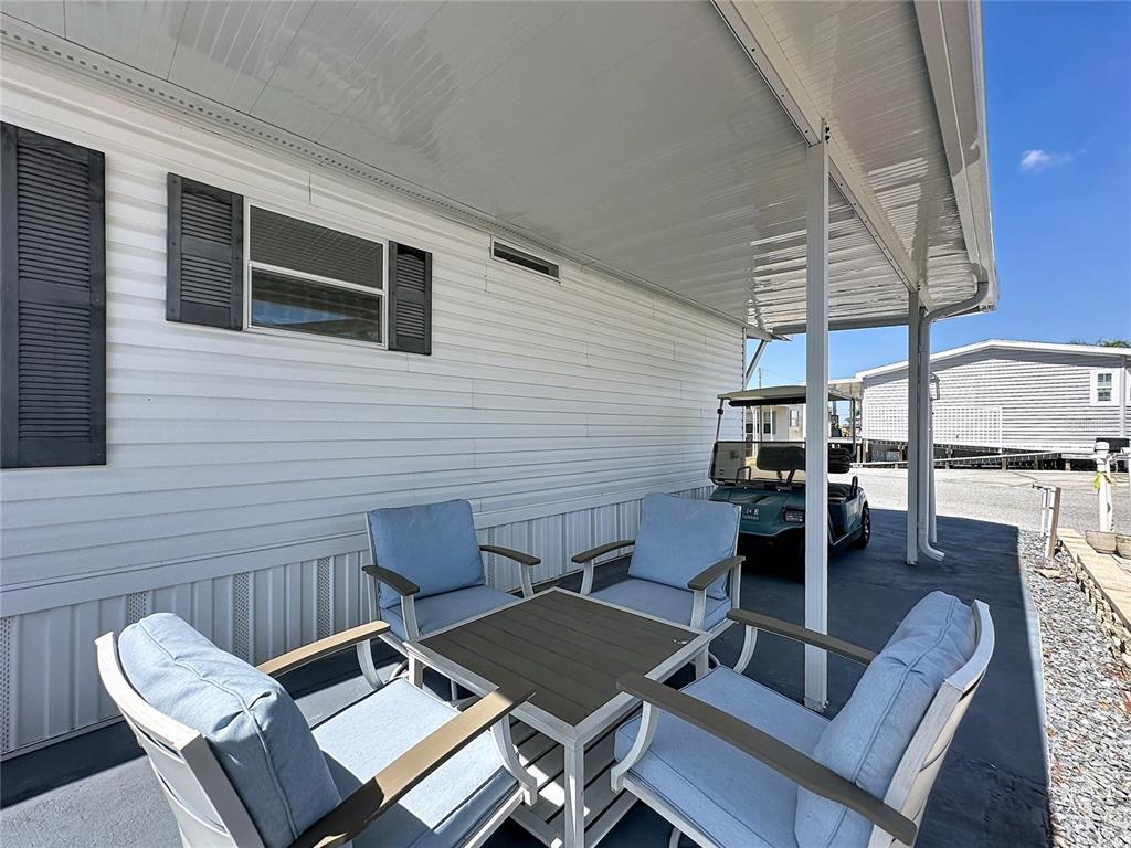 251 Patterson Road, Unit I3 Haines City, FL 33844 - Photo 3 of 38 a view of a patio with couple of chairs