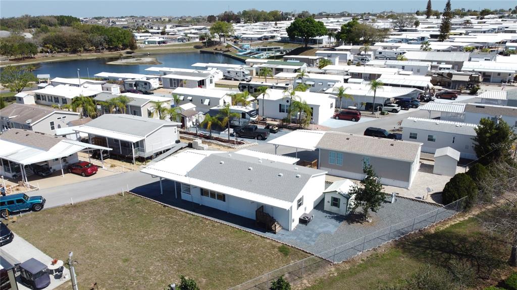 251 Patterson Road, Unit I3 Haines City, FL 33844 - Photo 32 of 38 green view of residential houses with outdoor space